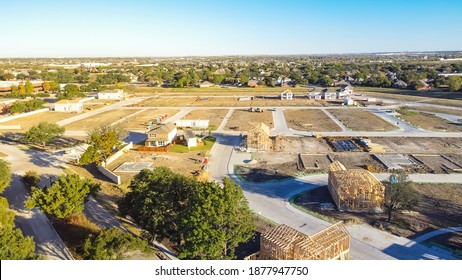 Top View Unfinished And A Model House At Construction Site Of Master Planned Community Suburbs Dallas, Texas, America. Typical Two Story Single Family Home On Slab Foundation