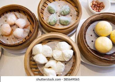 Top View Of A Variety Of Dim Sum In Bamboo Steam Containers.