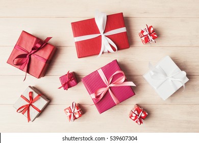 Top view of various gift boxes on wooden table - Powered by Shutterstock