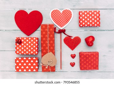 Top view of various gift boxes on wooden table. Happy Valentines Day scene
