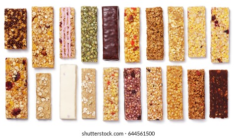 Top view of various healthy granola bars (muesli or cereal bars). Set of energy, sport, breakfast and protein bars isolated on white background