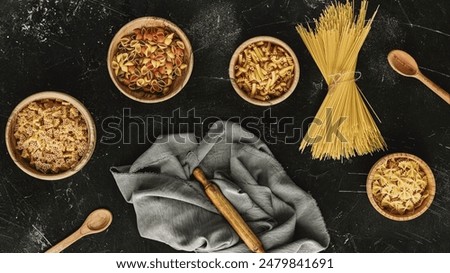 A top view of various pasta types in bowls