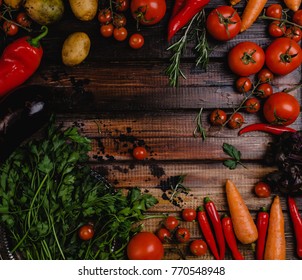 top view of various raw vegetables on wooden table