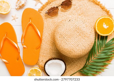 Top view of various seashells placed near colorful fruit and stylish summer accessories on table background. Summer concept. Flat lay. Top view with copy space for text.