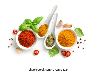 Top view of various spices in bowls and spoons isolated on white background. - Shutterstock ID 1725804124