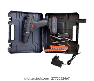 Top view of a versatile electric screwdriver and impact drill set with multi-functional attachments organized in a professional plastic toolbox.