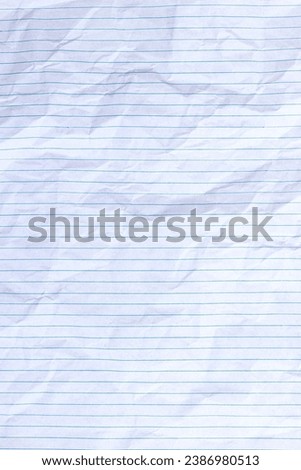 Top view vertical empty rumpled lined paper with wrinkled. Notebook lined paper background and texture.