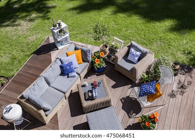 Top View Of A Villa Patio With Wooden Flooring Ana Rattan Furniture Set