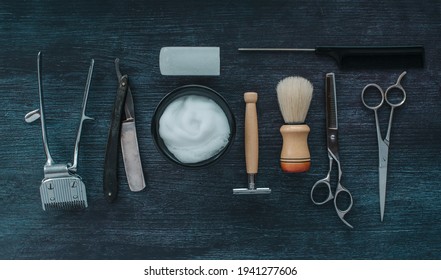 Top View Vintage Barber Shop Tools. Razor, Scissors, Brush, Shaver, Alum On Dark Wooden Background, Old Style Tools