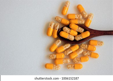 Top View Vitamin C Plus Zinc In Yellow Capsules On White Background .