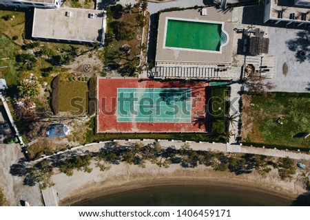 Top view: volleyball court on the street near the beach and the sea.