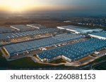 Top view of warehouses, aerial view of large logistics warehouses in the evening