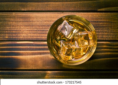 Top View Of Whiskey In Glass With Ice