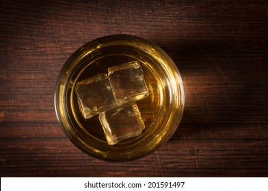 Top View Of Whiskey In Glass With Ice