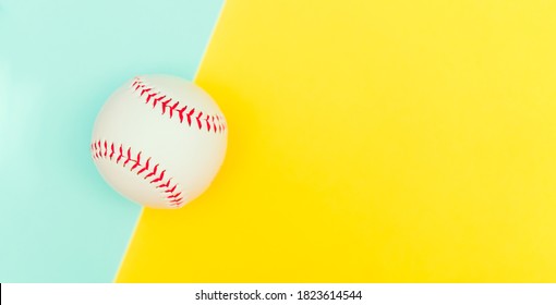 Top View Of White Baseball Ball With Red Seam Mockup On Yellow Blue Color Paper Background,Empty Round Fastball For Base Tournament Mock Up, Isolated.Japna And USA Game Championship Mokcup Template.