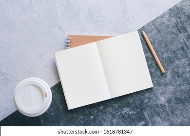 Top view white binder blank notebook or diary or journal for writing text and message with pencil and coffee cup on concrete background with copy space. Business and education concept.