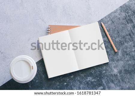Top view white binder blank notebook or diary or journal for writing text and message with pencil and coffee cup on concrete background with copy space. Business and education concept.