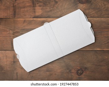 Top view of white blank new folded donner kebab paper packaging on wooden background