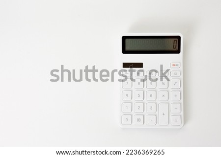 Top view of white calculator isolated on white background.