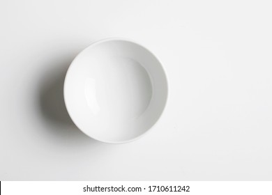 Top view of white empty ceramic dip bowl isolated on white - Shutterstock ID 1710611242