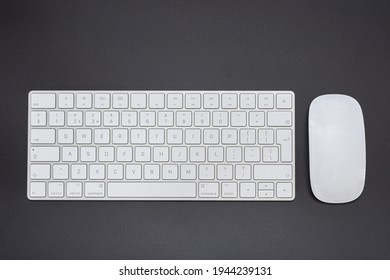 Top view white keyboard and mouse  on black background - Shutterstock ID 1944239131