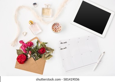 Top view of white office female workspace with laptop