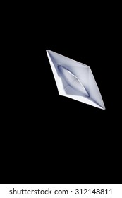 Top View Of A White Origami Paper Boat On Black Background.