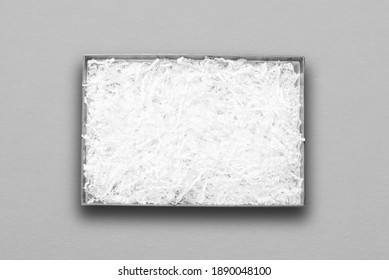 Top view, white paper filler in grey carton box