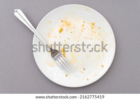 Top view of white plate, fork and food leftover  ストックフォト © 