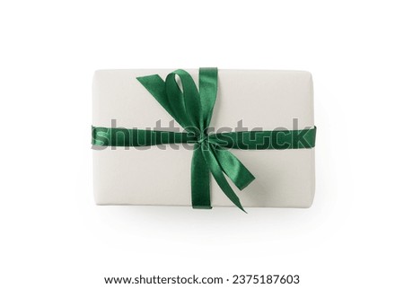 Top view of white present box with green ribbon isolated on white