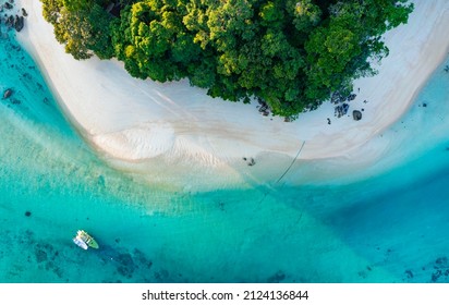 Top view of white sand beach tropical  with seashore as the island in a coral reef ,blue and turquoise sea Amazing nature landscape with blue lagoon 