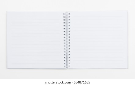 Top View Of White Spiral Book On White Background