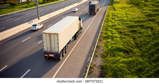 Top view of White Truck motion blur on highway road with container, transportation concept.,import,export logistic industrial Transporting Land transport on the expressway.soft focus
