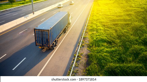 Top view of White Truck motion blur on highway road with blue container, transportation concept.,import,export logistic industrial Transporting Land transport on the expressway.soft focus