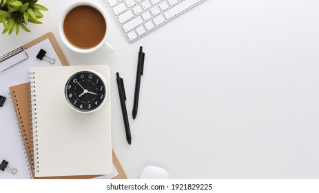 Top View White Wooden Workspace Office Desk With Computer And Office Supplies. Flat Lay Work Table With Blank Notebook, Keyboard, Green Cactus And Coffee Cup. Copy Space For Your Advertising Content.