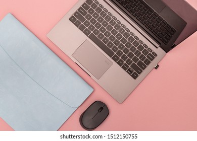 Top View Of White Working Table With Modern Laptop, Blue Leather Case For Personal Computer And Wireless Mouse. Work Space For School Or Office. Template And Copy Space. Flat Lay.