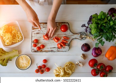 Top View Of Woman Cooking Healthy Food. Hands In The Image. Fresh Vegetables On The Cutting Board. Concept Of Cooking. Diet. Dieting Concept. Healthy Lifestyle. Cooking At Home. Prepare Food.