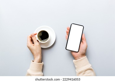 Top view of woman hands holding smart phone with blank copy space screen for your text message or information content. woman hand using phone white screen on top view.