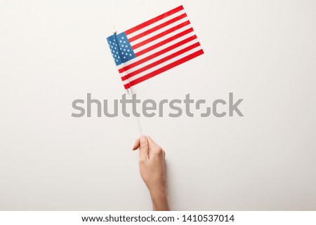 top view of woman holding american flag on white background 