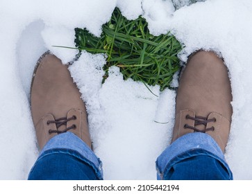 Top view woman legs in hiking leather boots on covered snow forest glade and green grass, concept activity and adventure outdoors - Powered by Shutterstock