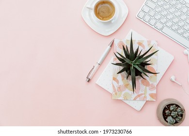 Top view woman office desk and supplies, coffee cup, keyboard with copy space. Creative flat lay photo of workspace desk, blogger concept