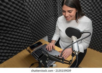 Top View Of A Woman Recording A Podcast In An Audio Booth