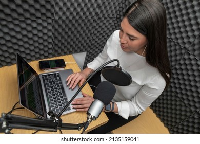 Top View Of A Woman Recording A Podcast In An Audio Booth