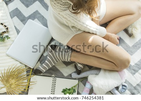 Top view of woman sitting in bad with laptop, notebookStudent studying outdoors. Copy space for text. Flatlay