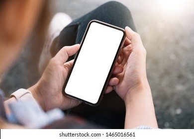 Top View Woman Sitting And Holding Blank Screen Mock Up Mobile Phone