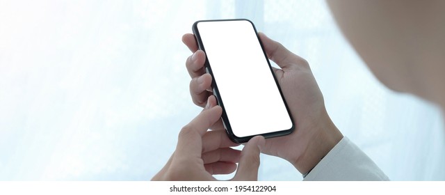 Top View Woman Sitting And Holding Blank Screen Mock Up Mobile Phone