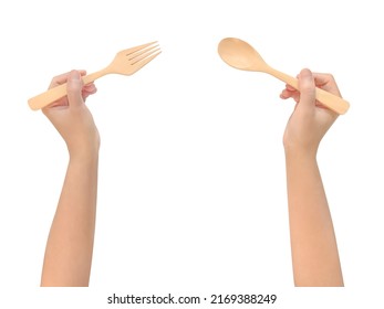 Top view woman's hands holding a wooden spoon and fork, waiting to eat isolated on white background - Powered by Shutterstock