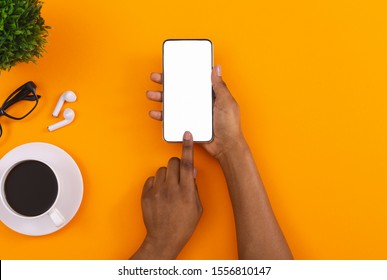 Top View Of Woman's Hands Using Touching Blank Screen On Smartphone, Downloading App For Listening Music Online In Erphones, Copy Space