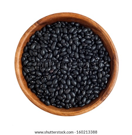 Top view of wooden bowl full of black beans