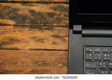 Top View Of Wooden Office Desk With Laptop